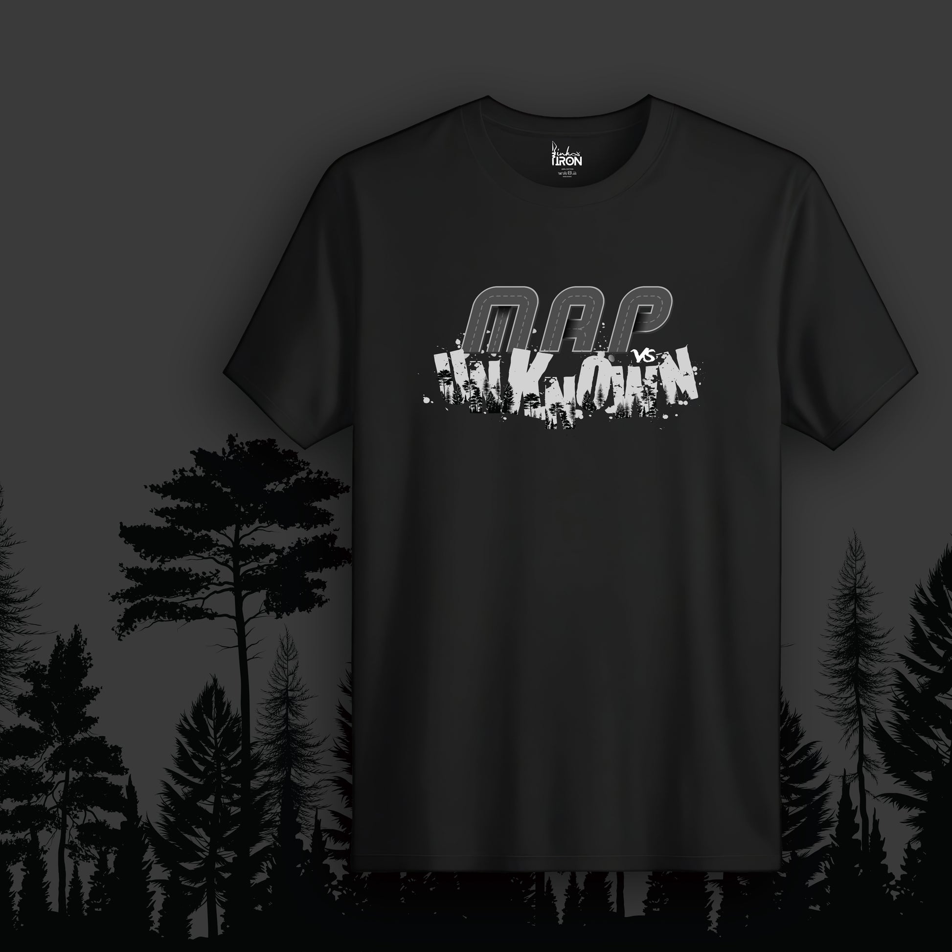 Map vs Unknown T-Shirt (Black) - Features fragmented “Map vs Unknown” text layered over a silhouetted forest landscape, creating a raw and rebellious aesthetic.