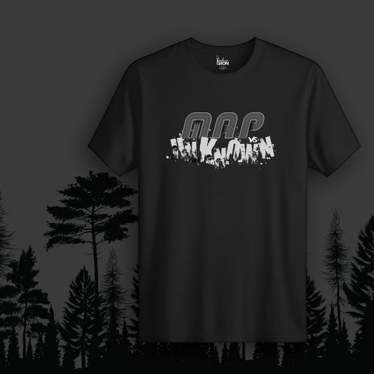 Map vs Unknown T-Shirt (Black) - Features fragmented “Map vs Unknown” text layered over a silhouetted forest landscape, creating a raw and rebellious aesthetic.