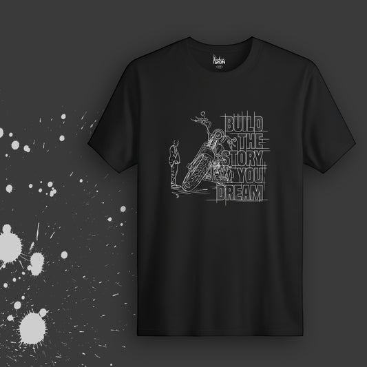 Build The Story You Dream T-Shirt (Black) - Features hand-drawn artwork of a climber scaling a dream with intricately designed typography that inspires growth and imagination.
