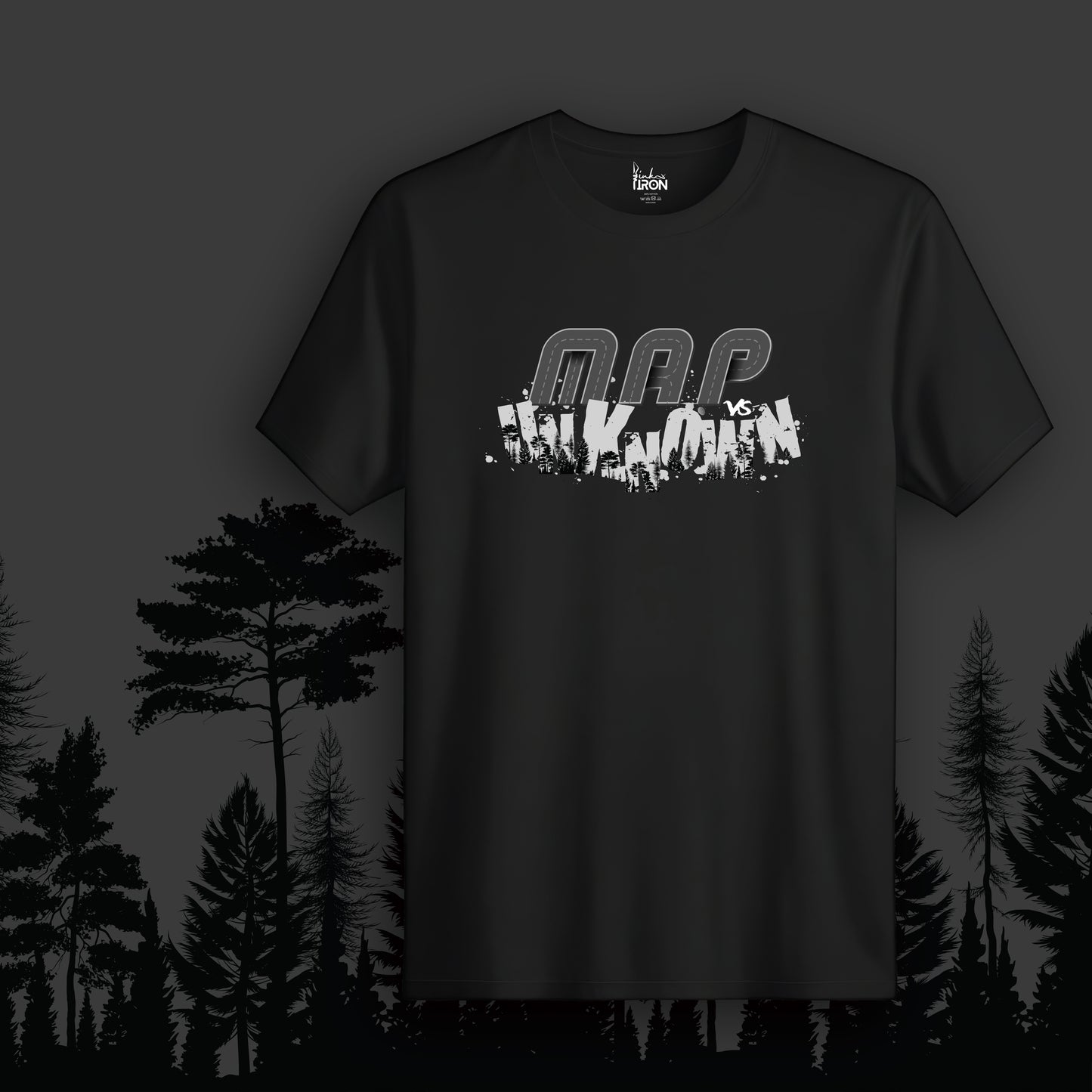 Map vs Unknown T-Shirt (Black) - Features fragmented “Map vs Unknown” text layered over a silhouetted forest landscape, creating a raw and rebellious aesthetic.