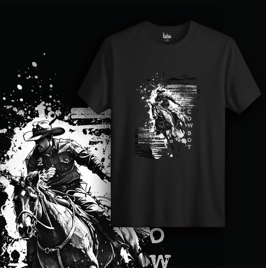 Cowboy T-Shirt (Black) – Dynamic graphic of a bold cowboy in motion layered over abstract ink textures, finished with distressed “COWBOY” text for a raw, unfiltered Western vibe.