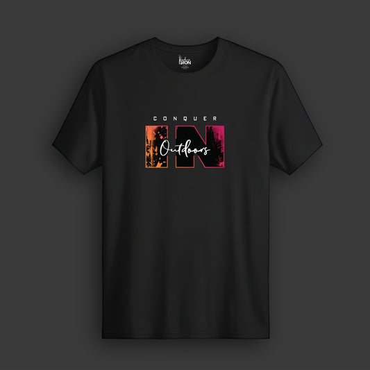 Conquer In Outdoors T-Shirt (Black) - Features a stylized mountain and skyline motif with powerful text design.